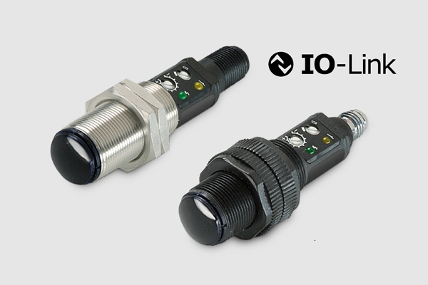 SpaceMaster SM 7000-IO высокопроизводительная и универсальная линейка цилиндрических фотоэлектрических датчиков M18, включающая автономный передатчик SMT и приёмник SMR, которые используются в режиме сквозного луча (thru-beam), SMP для диффузного обнаружения (diffuse proximity), SMRR для ретроотражательного режима (retro reflective) и SMPF для работы с оптическими волокнами